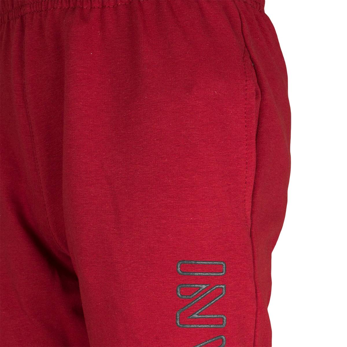 Spodnie dresowe dla chłopca, kolor bordowy, aplikacja na nogawce INVASION, Tup Tup