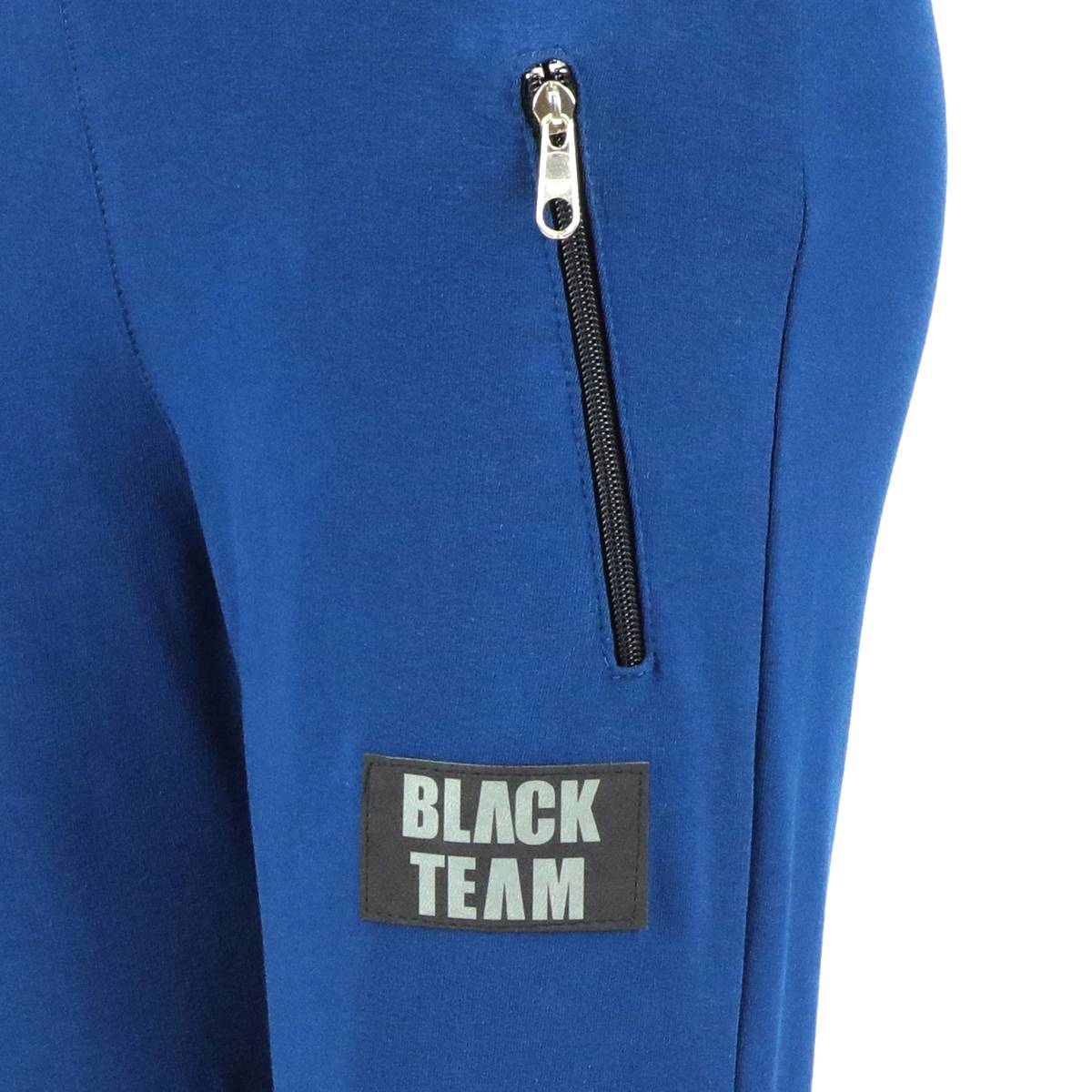 Spodnie dresowe dla chłopca, kolor niebieski, naszywka na nogawce Black Team Tup Tup